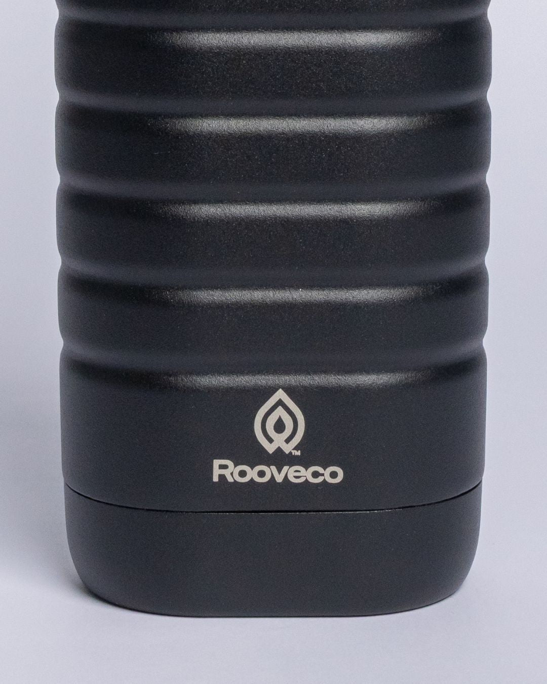 Close-up product shot of a Rooveco tumbler showing the logo and highlighting product quality.